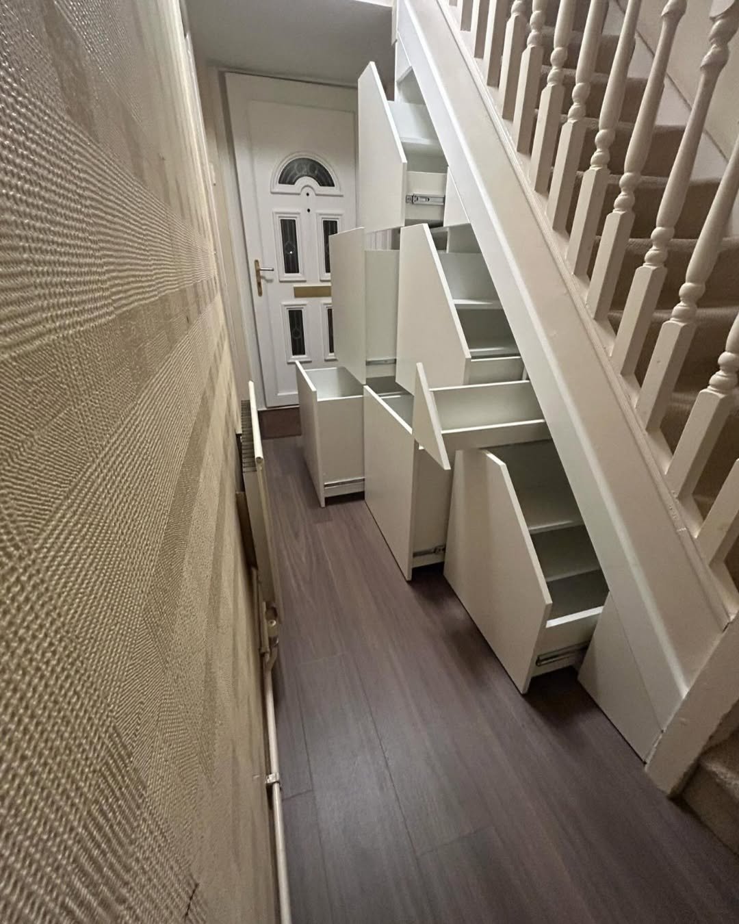 under stairs storage in Clever Small Entryway
